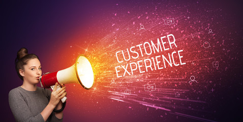 Young woman yelling to loudspeaker with CUSTOMER EXPERIENCE inscription, social networking concept