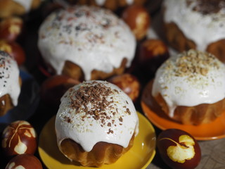 Easter. Cooking Easter cakes at home. Easter baking with natural sprinkles and colored eggs on a wooden ancient background.
