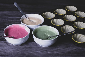 The dough for cupcakes was painted in different colors.