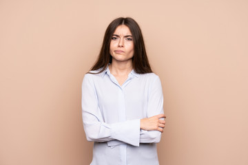 Young woman over isolated background feeling upset