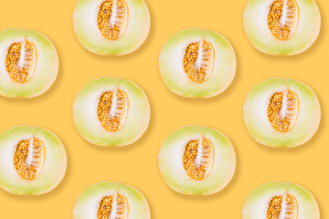Melon pattern. Melon slises on bright yellow background. Summer concept. Top view. Flat lay
