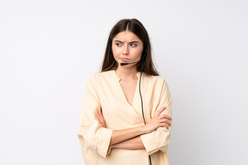 Fototapeta premium Young telemarketer woman over isolated white background thinking an idea