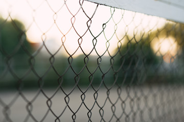 Panoramic view of the fence grid with a sports field behind