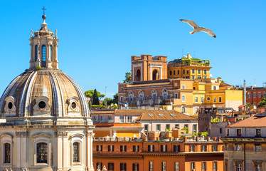 Rome in summer, Italy. Colorful vintage houses with terraces near famous Trajan Forum in Rome...