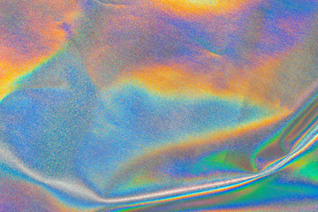 Iridescent fabric trendy holographic background. Rainbow background Colorful chrome fabric.
