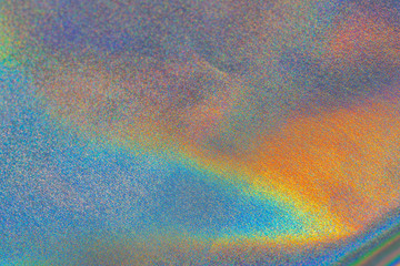 Iridescent fabric trendy holographic background. Colorful chrome fabric.