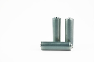 Several AA batteries in perspective closeup view on white background.