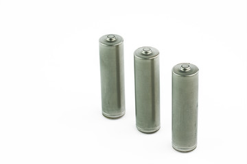 Several AA batteries in perspective closeup view on white background.