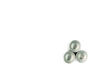 Several AA batteries in perspective closeup view on white background.