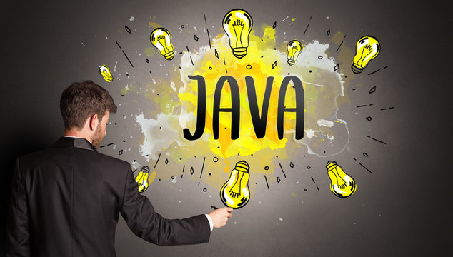 businessman drawing colorful light bulb with JAVA abbreviation, new technology idea concept