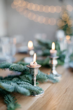 Close-Up Of Lit Candles On Table Christmas Decorations On Table