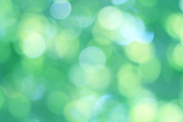  Abstract bokeh, natural green and blue background, beautifully blurred during the summer, which is a blue-green bokeh taken from the leaves on the tree and has a yellow-blue light