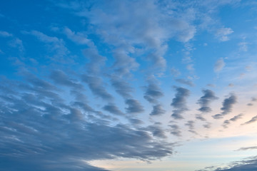 Fototapeta na wymiar Scattered clouds on evening sky