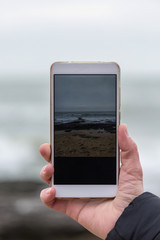 Smartphone in a woman's hand.