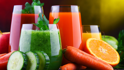 Glasses with fresh organic vegetable and fruit juices