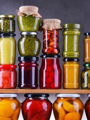 Jars with variety of pickled vegetables and fruits
