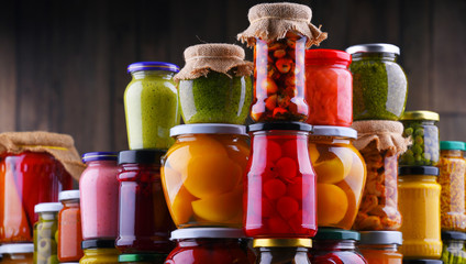 Jars with variety of pickled vegetables and fruits