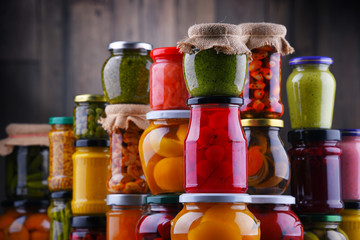 Jars with variety of pickled vegetables and fruits