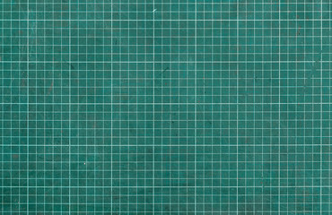 Used green cutting mat with printed grid line. Mat with non-slip and non reflective thick surface. Blade-resistant mat for crafting materials without damaging surfaces. Mat for precise jobs.