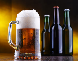 Composition with glass and bottles of beer