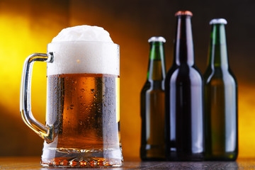 Composition with glass and bottles of beer