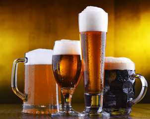 Composition with four glasses of beer