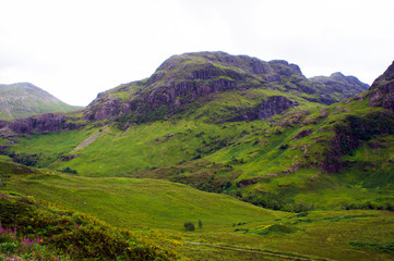 Fototapeta na wymiar The untamed hills of Glen Coe in the Scottish Highlands, site of the infamous massacre of the MacDonald clan.