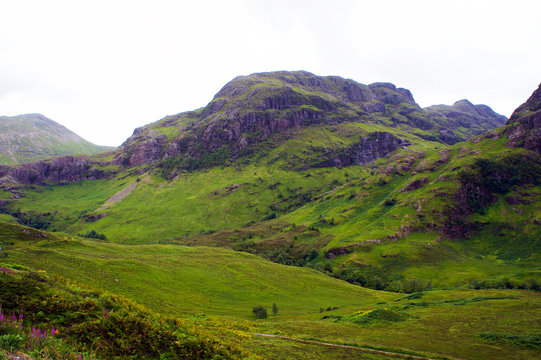 The Untamed Hills Of Glen Coe In The Scottish Highlands, Site Of The Infamous Massacre Of The MacDonald Clan.