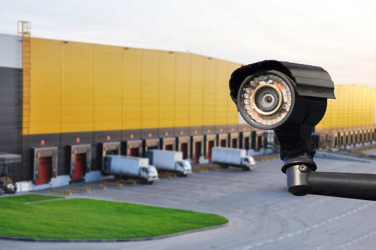 closed circuit camera Multi-angle CCTV system against the background of a modern warehouse complex.