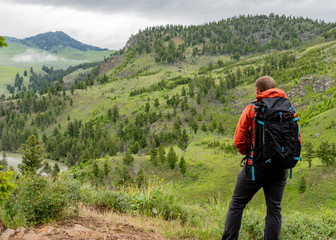 Man with Pack Looks Out Over Yellowstone