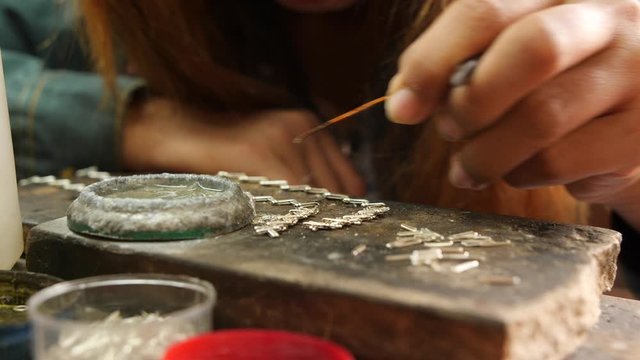 Woman Making Traditional Burmese Silver Necklace. Silversmiths Floating Village On Inle lake. 4K Close Up Footage. Myanmar.