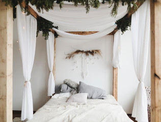 Modern home interior design. Bed with pillows, blanket. Bedroom interior, scandinavian style. Home decor.  © paralisart