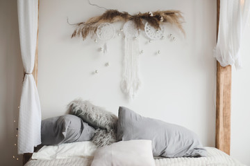 Modern home interior design. Bed with pillows, blanket. Bedroom interior, scandinavian style. Home decor.  © paralisart