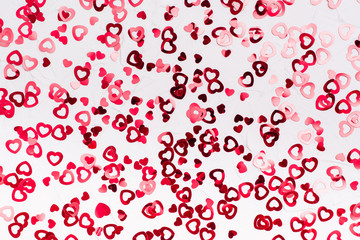 Valentine's Day. Many shiny red hearts on a white background