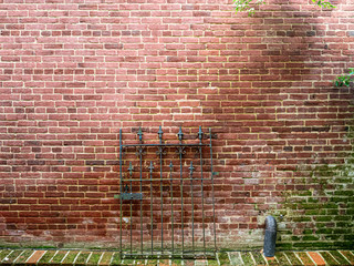 Brick Wall With Iron Gate Background