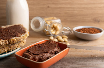Homemade organic vegan chocolate spread, made of almonds and organic cacao and honey.