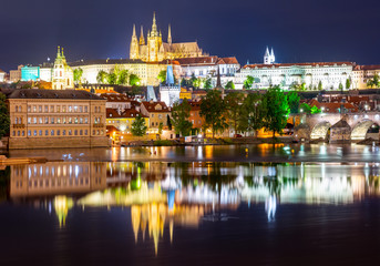 Fototapeta na wymiar Prague Castle with St. Vitus Cathedral over Lesser town (Mala Strana) and Charles bridge at night, Czech Republic