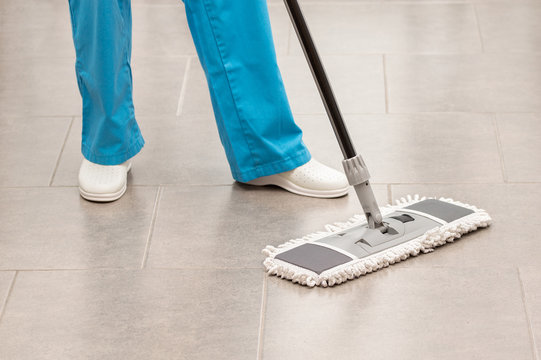  woman mopping the office floor