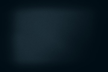 Abstract grainy background in a dark frame, blue tonality.