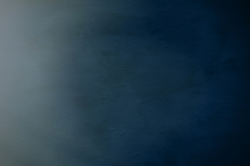 Cement plaster wall in a dark blue tone. Background for design.