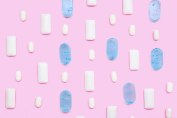 Different chewing gums on color background