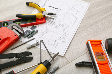 Furniture assembling plan with set of tools on table