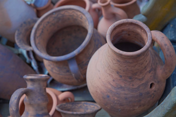 Pottery Craft Ceramic. clay dishes .Old Ceramic tableware is handmade on the counter . handmade clay ware.Pottery Craft Ceramic. Different pottery products: bowls, vases, jars . handmade clay ware.