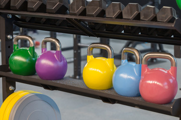Naklejka na ściany i meble Colorful Kettlebells and Medicine Balls for Fitness