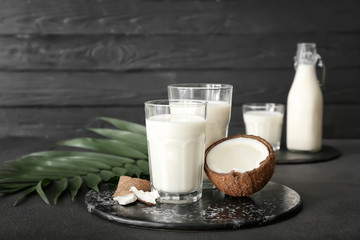 Tasty coconut milk on dark background
