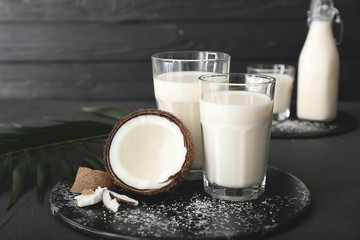 Tasty coconut milk on dark background
