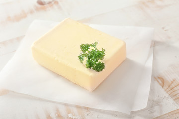 Fresh butter on white table