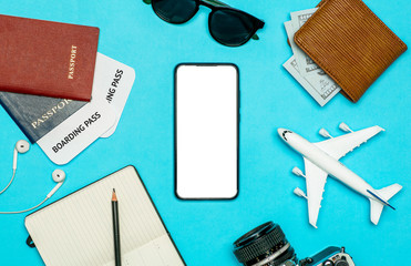 Travel apps for smartphone concept. Smartphone with blank screen on color travel background. Travel and tourist apps
