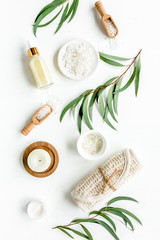 Spa concept with eucalyptus oil and eucalyptus leaf extract natural /organic spa cosmetics products, eco friendly bathroom accessories. Skincare concept on white background. Flat lay composition top v