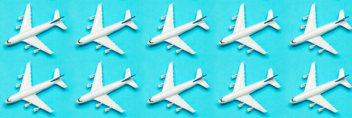 Travel minimal background banner. Model airplane in flight on an empty colored background. Copy space